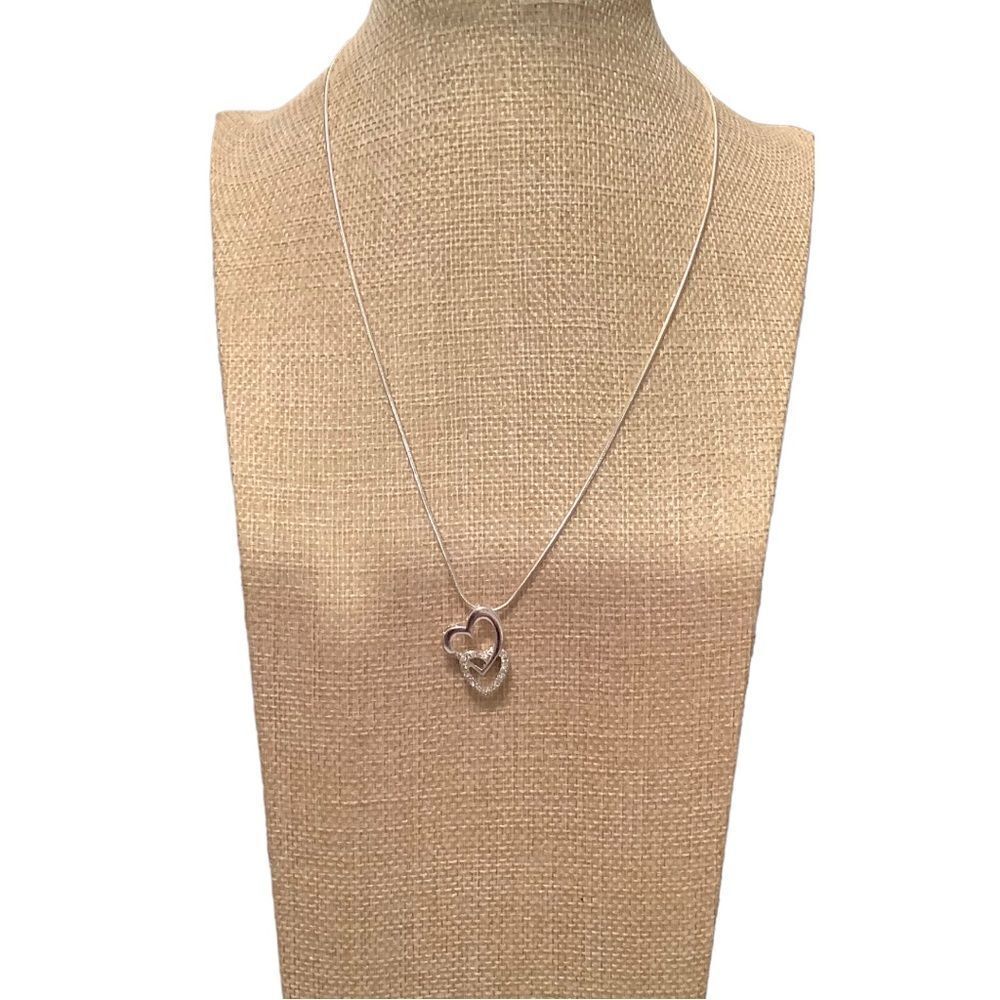 Silver tone two heart necklace. NWOT